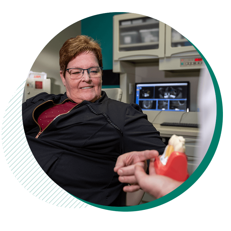 cindy points to dental implant mlodel
