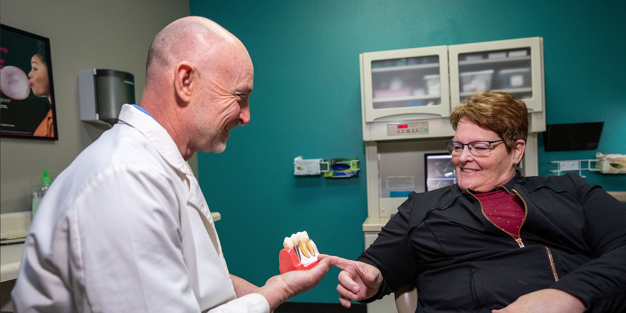 dr burke with cindy point dental implant