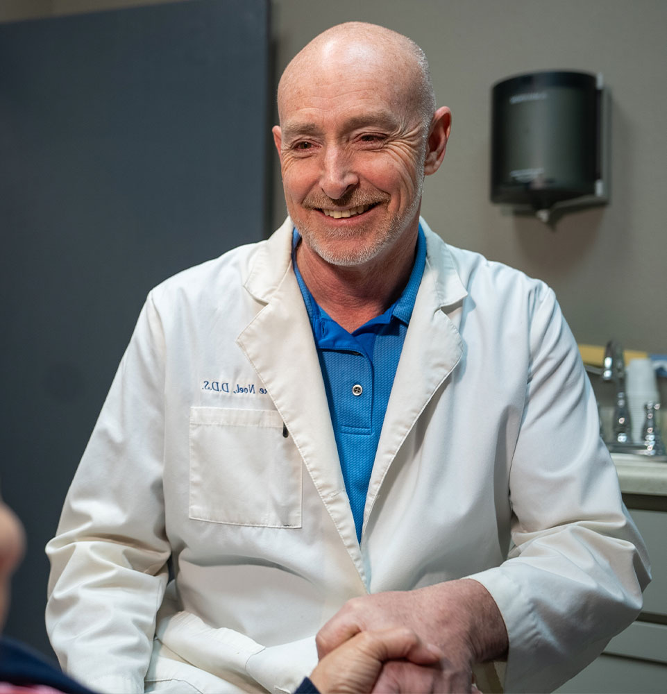 dr noel burke crowns handshake