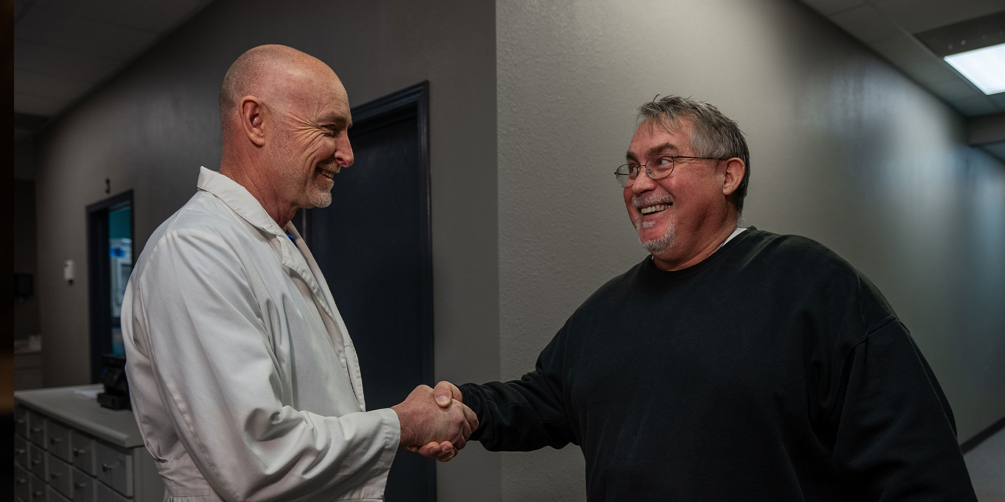 john with dr burke discussing